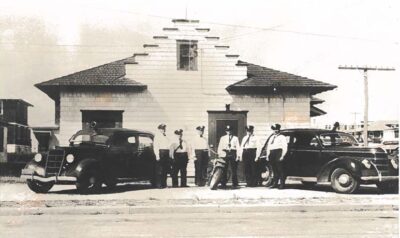 Historical Photo of Police Cars in front of Police HQ